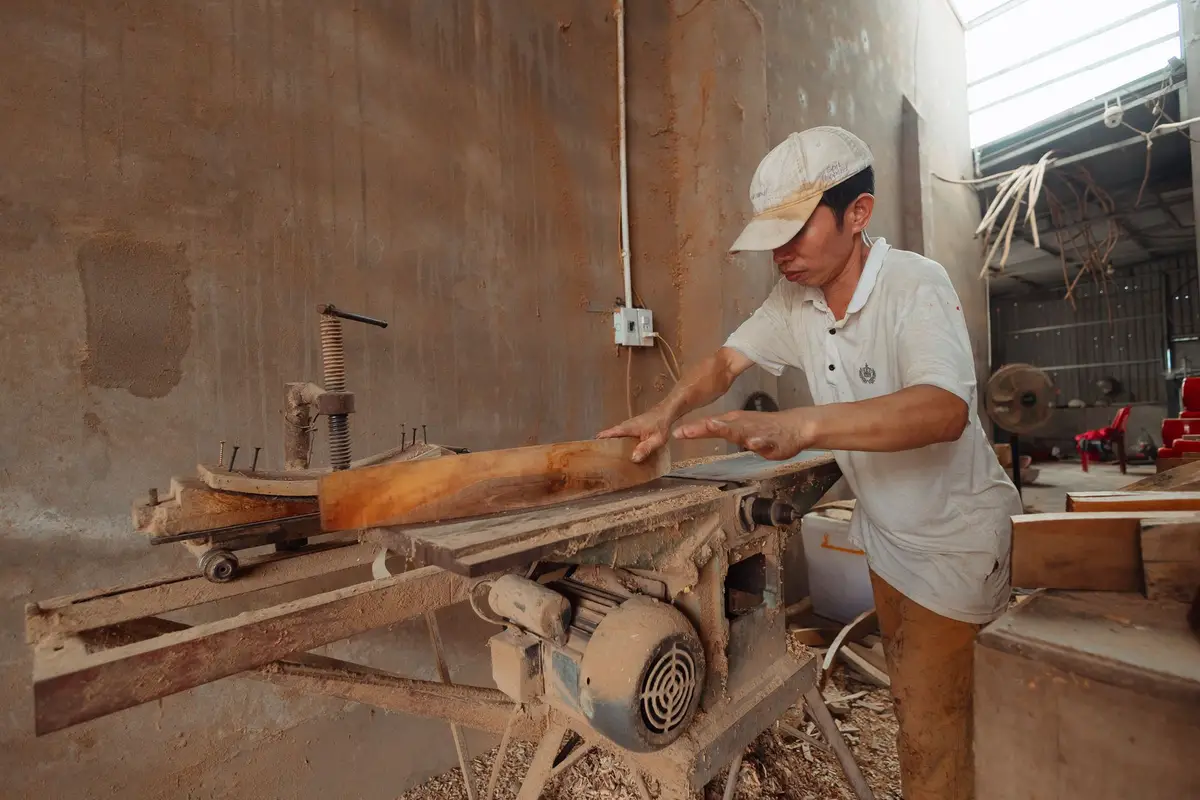 Carpenter cutting wood for cabinets and finish carpentry in Kyle, TX